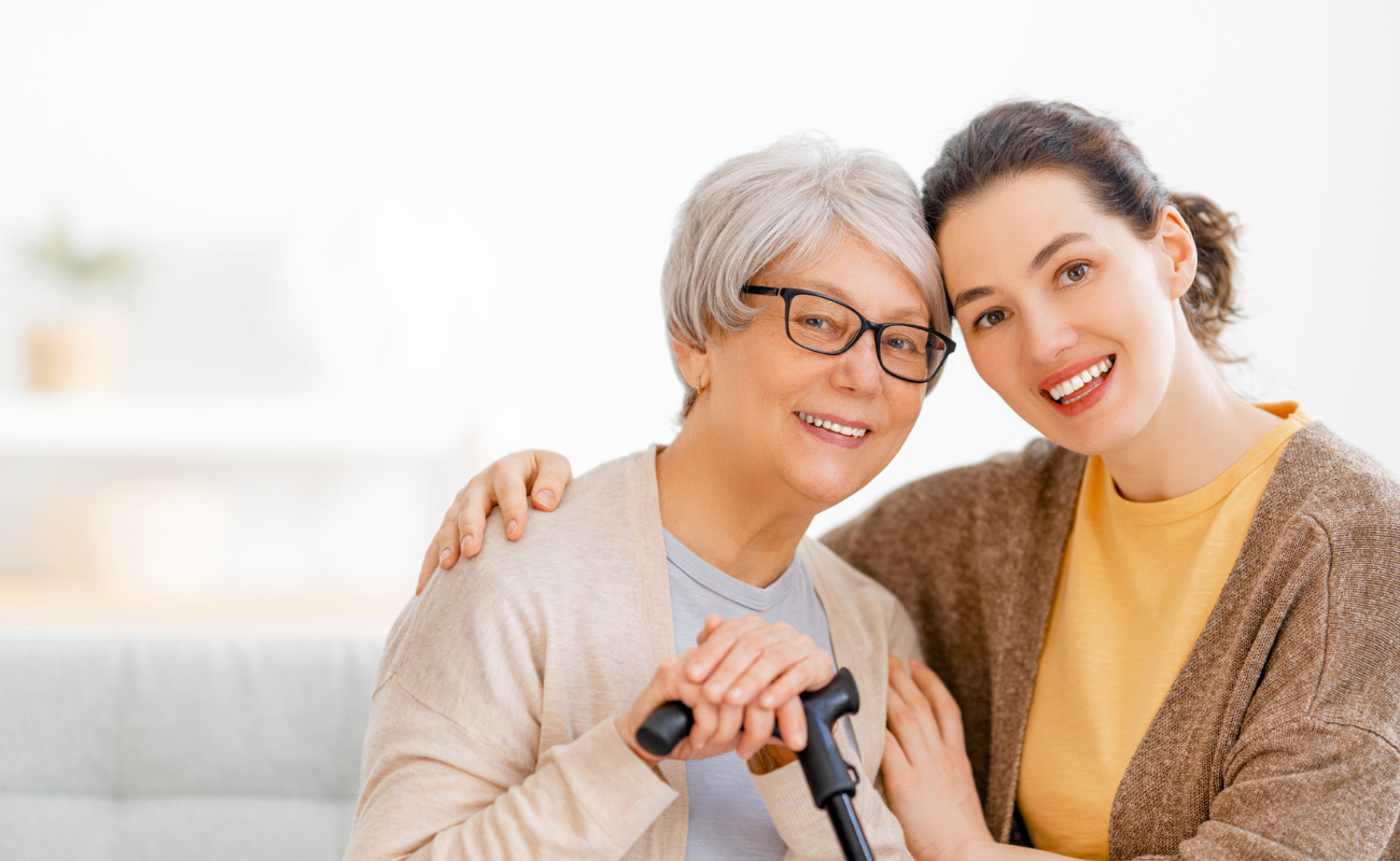 Middle-aged couple smiling while riding bikes on a sunny day