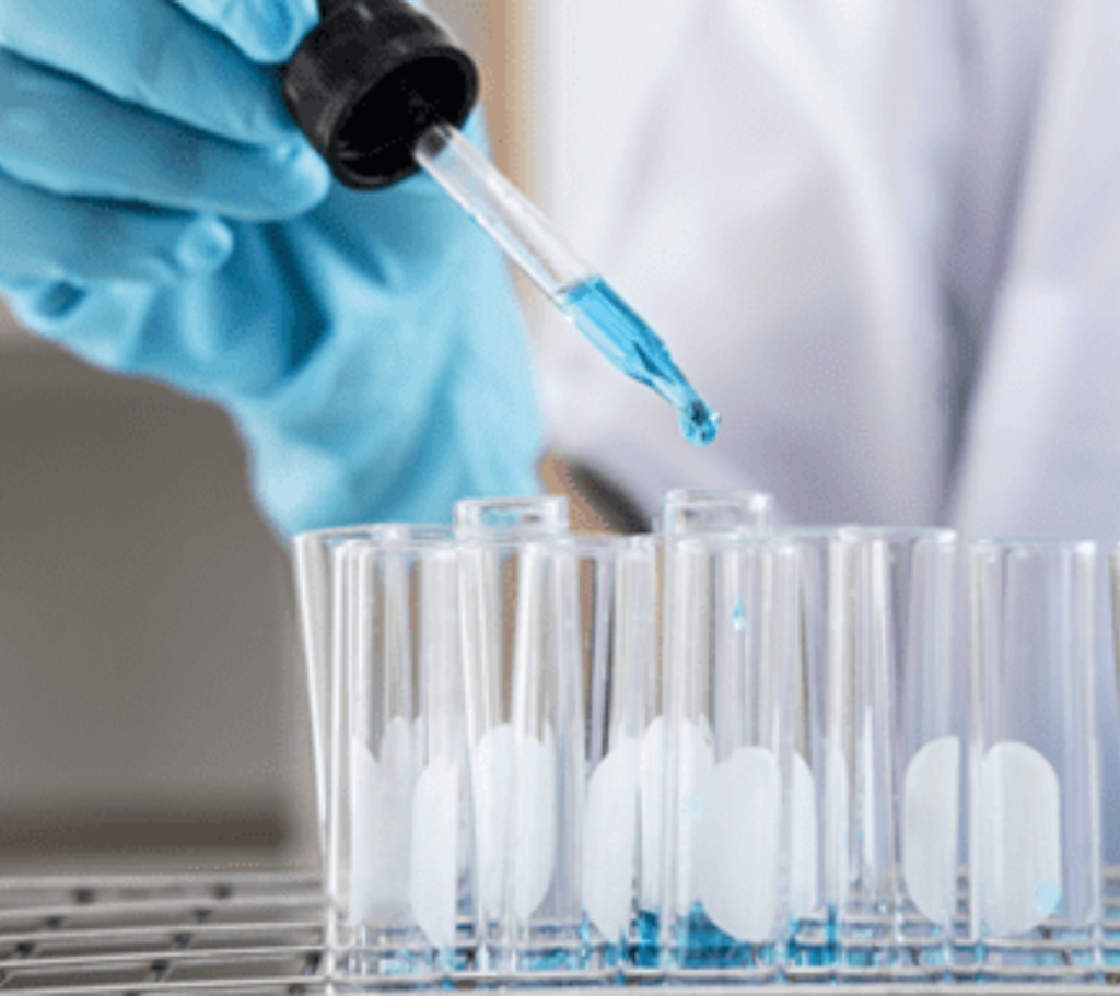 Pharmacist putting pills into clear bottles